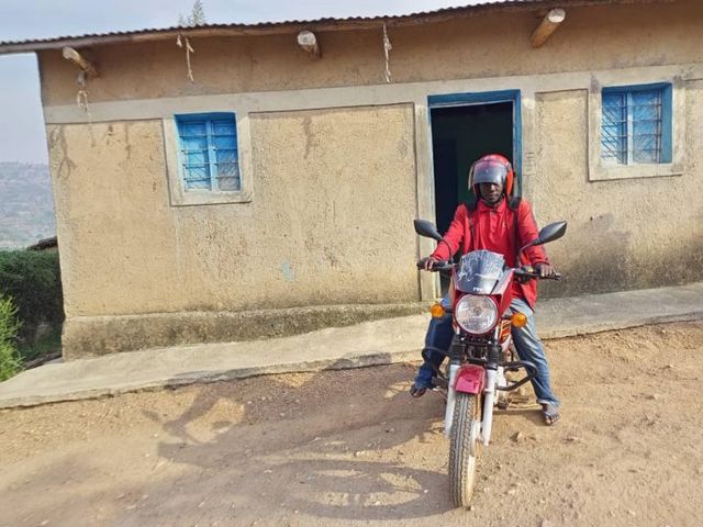 Bavugamenshi on a moto